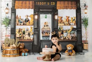 Vintage teddy bear store display with wooden shelving and brick wall background.