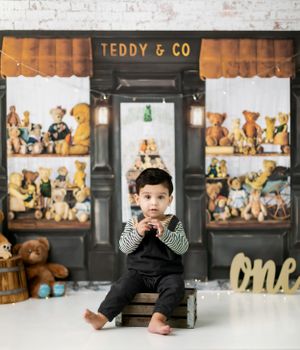 Teddy bear themed photo studio setup with vintage storefront display.