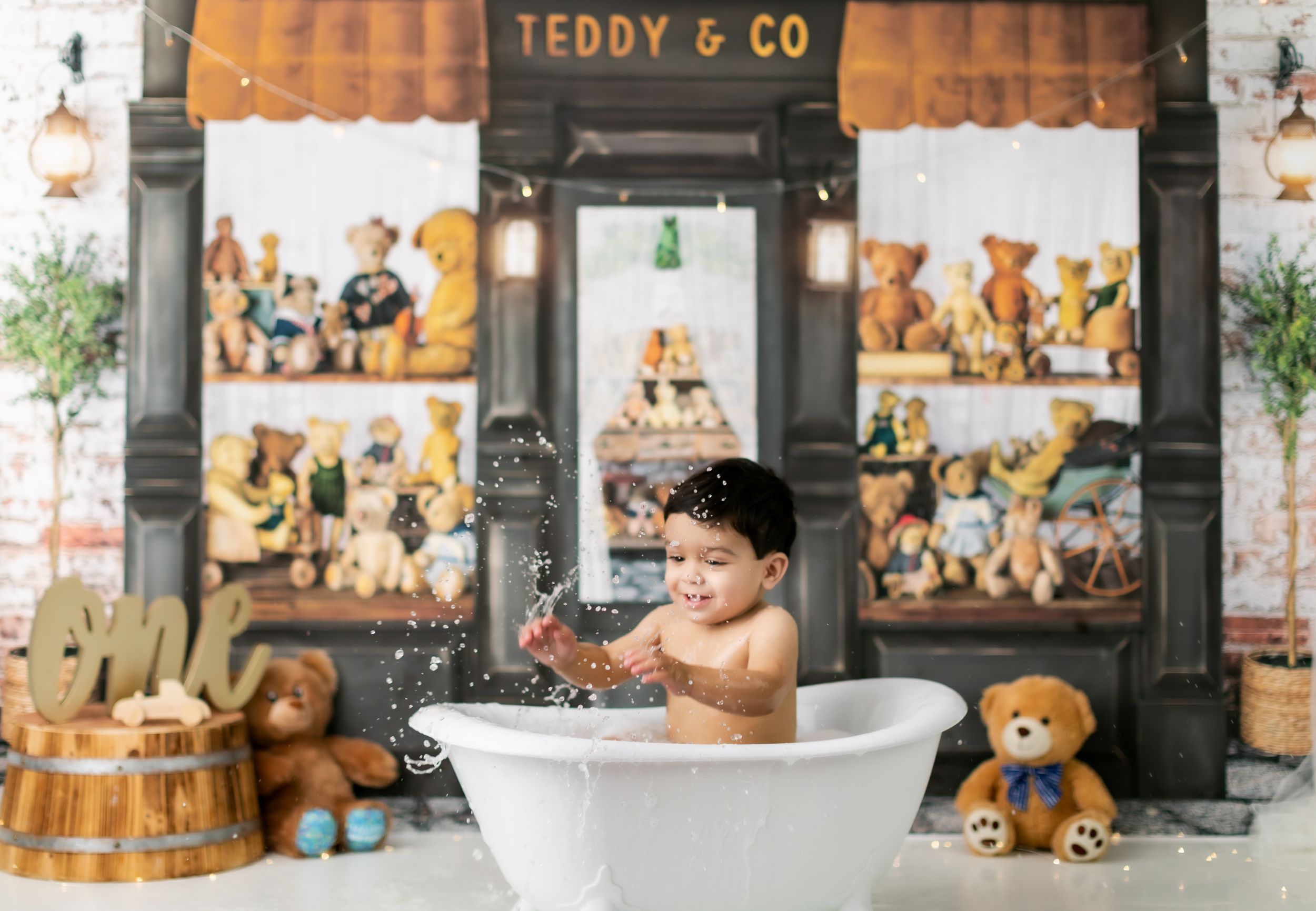Interior of Teddy & Co store showing bathtub display with plush bears and vintage-style decorations.
