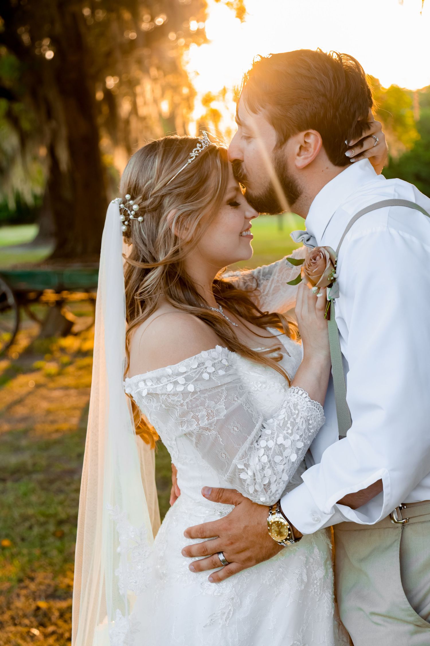 A romantic sunset wedding portrait capturing an intimate moment between the newlyweds.