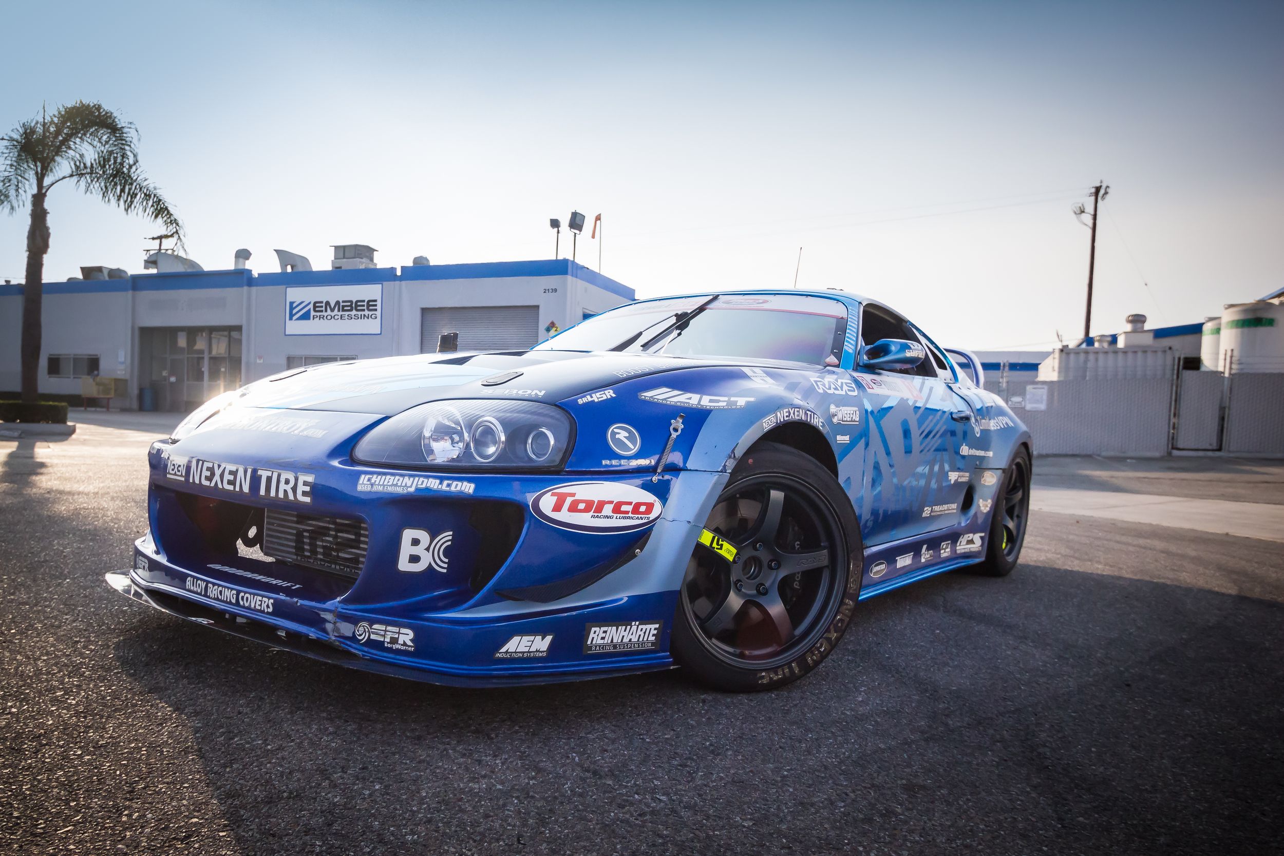 Driver side quarter panel view of RAD Industries Dan Burkett's blue Formula Drift Toyota Supra.