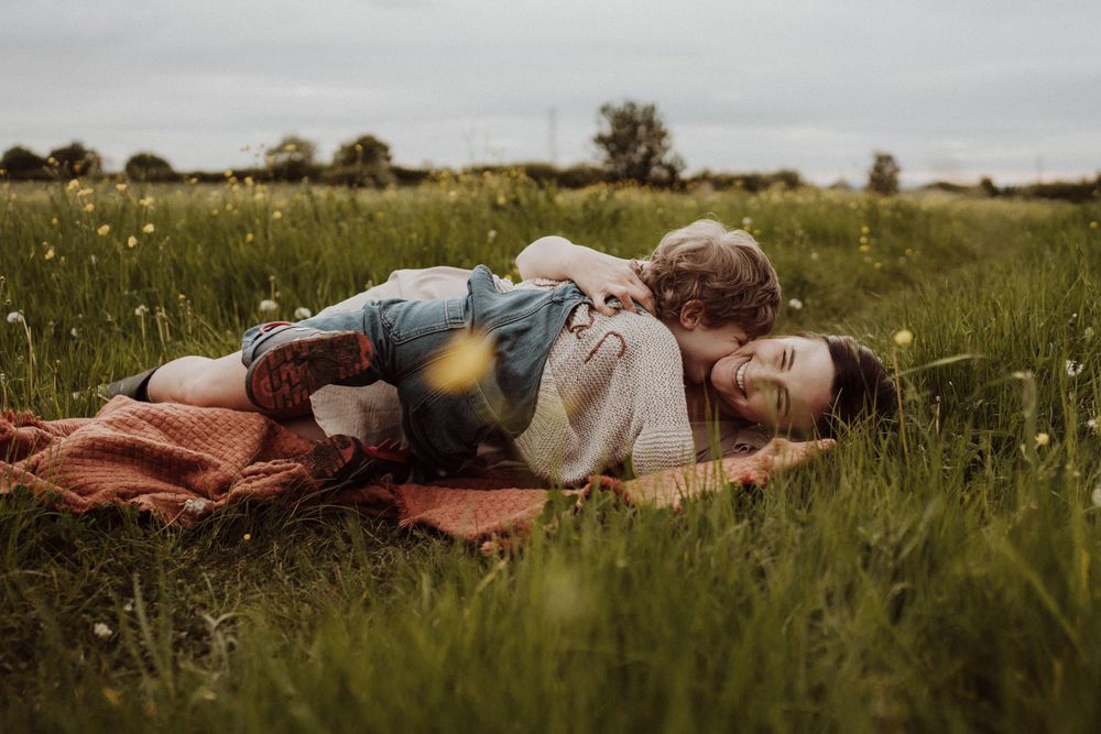 mum and son have a cuddle in the open Whitminster fields, Gloucestershire