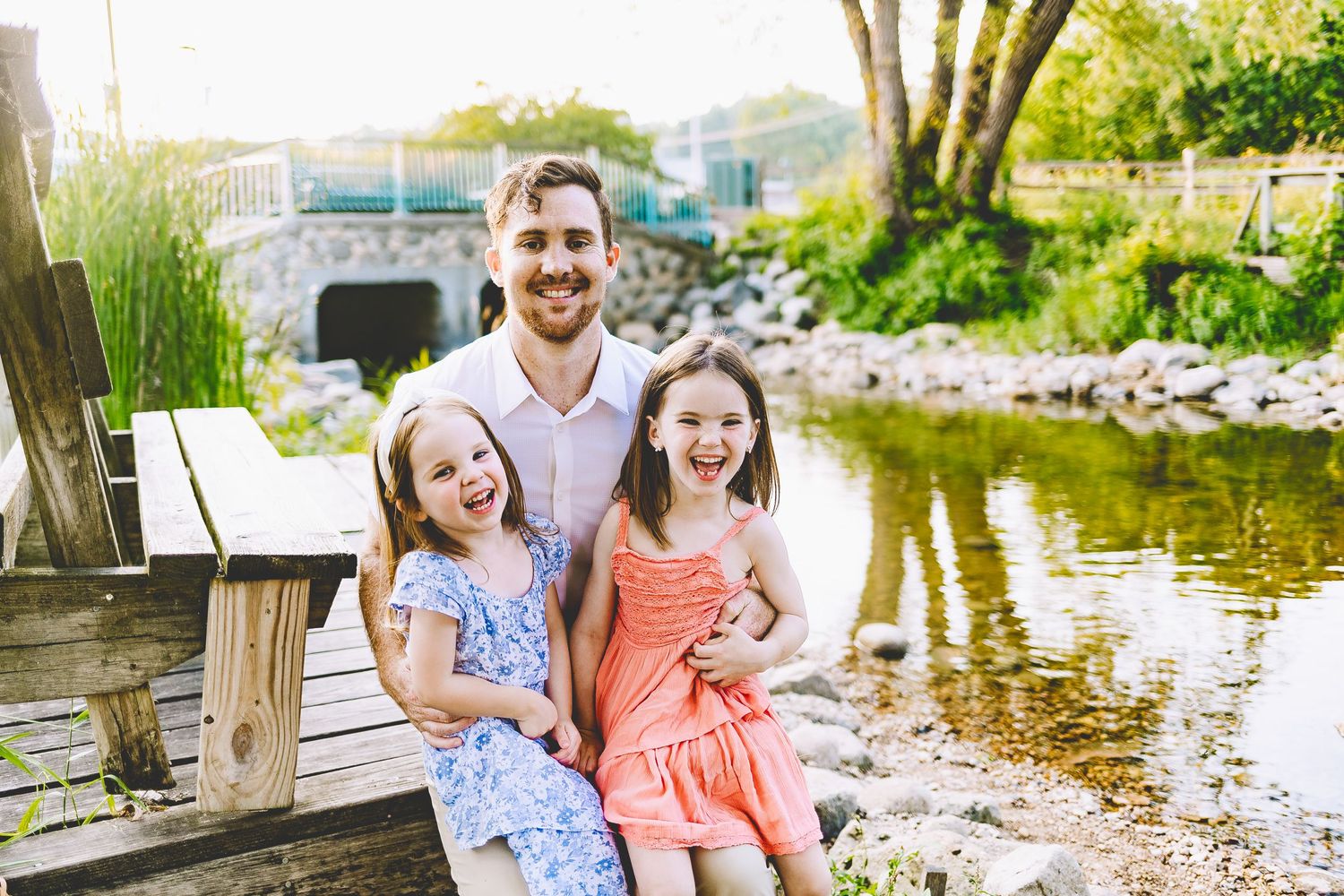 Dad and daughters smiling pewaukee wi family photoshoot