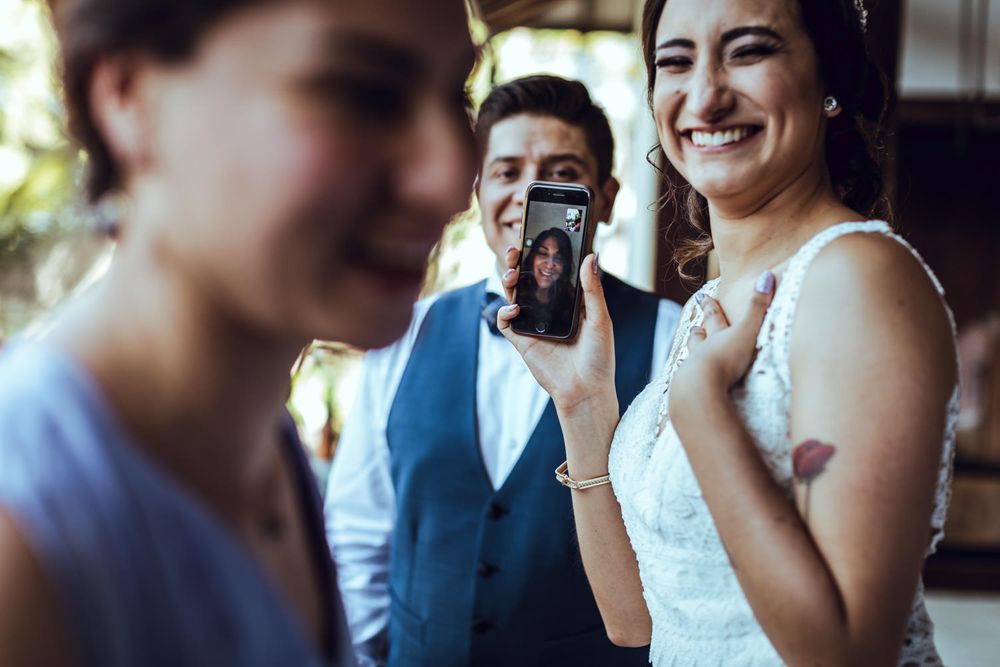 Wedding guests sharing joyful moments during an outdoor reception celebration.