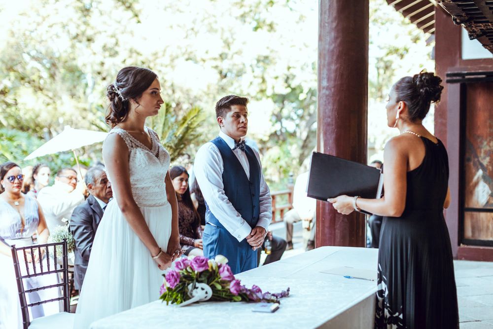 Wedding ceremony setup in a traditional Japanese temple pavilion.