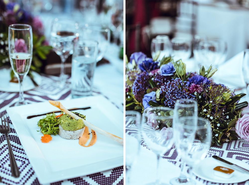 Elegant wedding table settings with plated appetizers and purple floral arrangements.