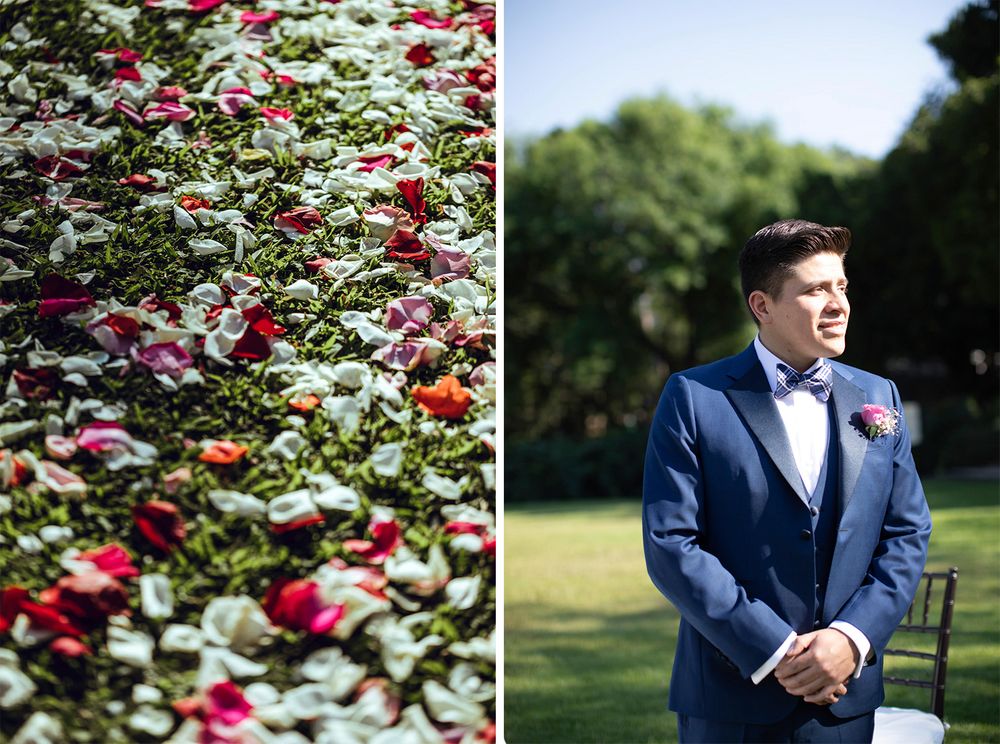 Garden wedding details with red roses and groom in navy suit amid floral arrangements.
