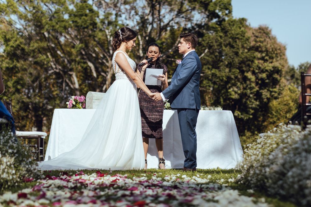 Outdoor wedding ceremony moments captured in series of candid shots with natural backdrop.