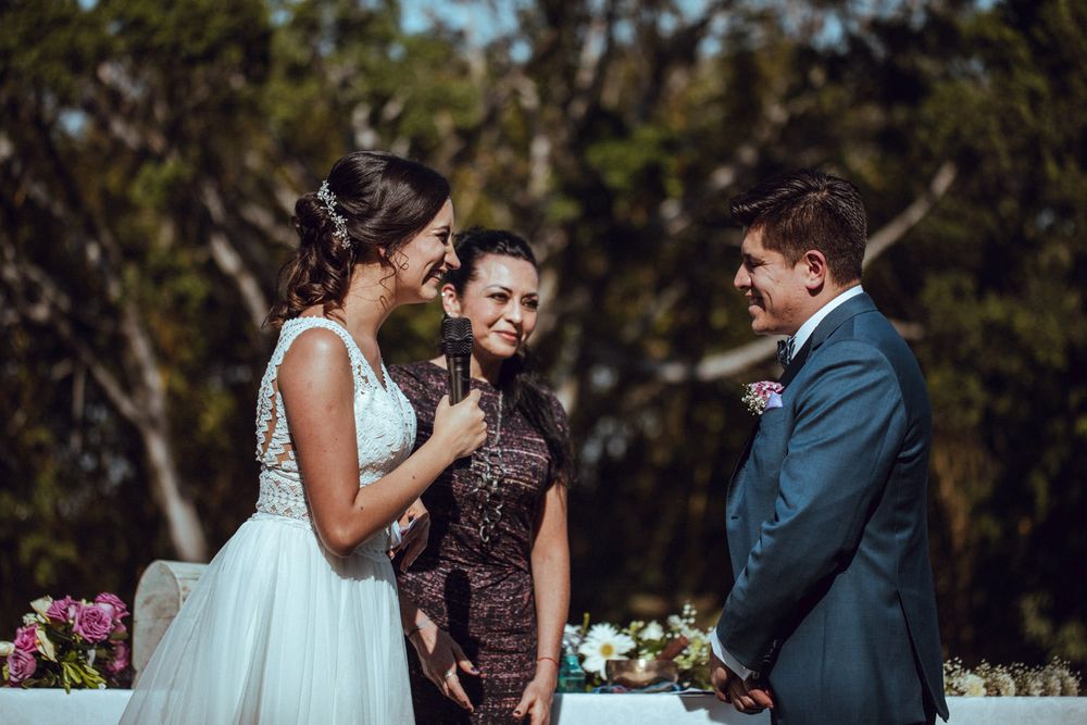 Intimate wedding ceremony moments between couple exchanging vows in garden setting.