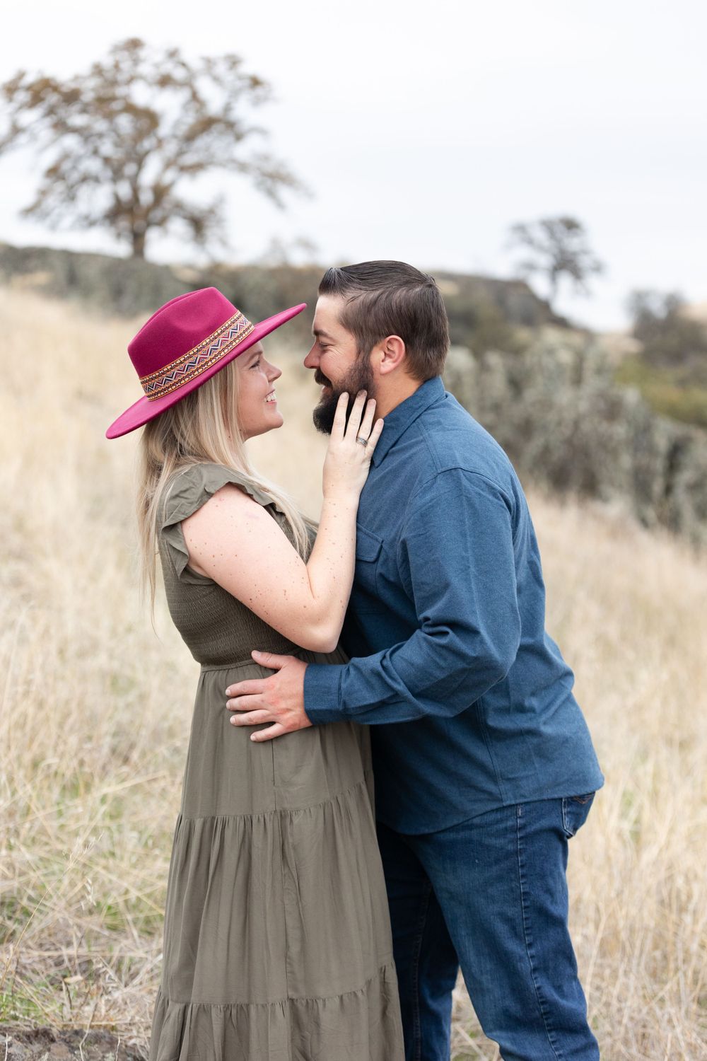 Couple at black butte lake in Orland, California woman is wearing a burgundy hat