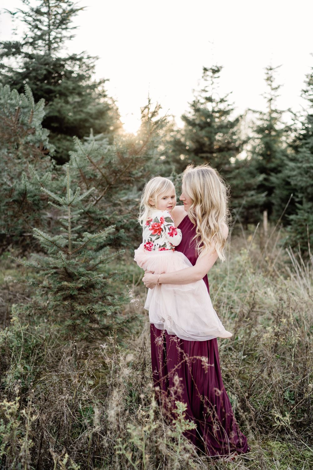 mother and daughter snuggle at the tree farm christmas card photo whatcom county photographer cristy holcomb