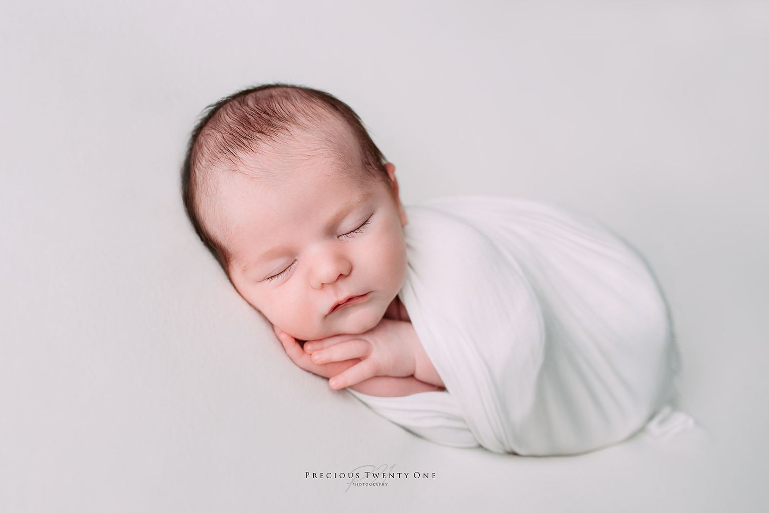 wrapped sweet newborn baby sleeping