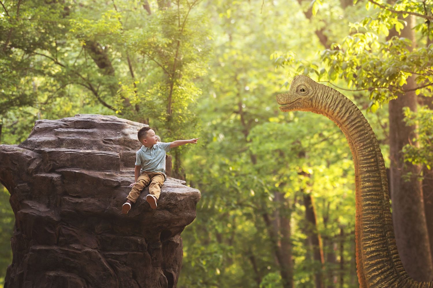 Whimsical children's portrait of a boy meeting a giant dinosaur in a magical forest setting.
