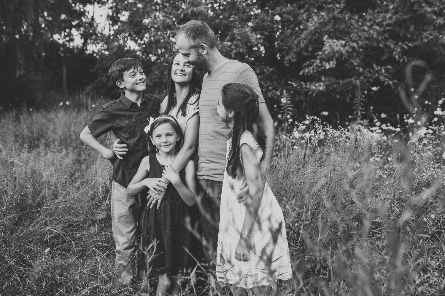 Family laughs in a wildflower field in Lebanon, PA