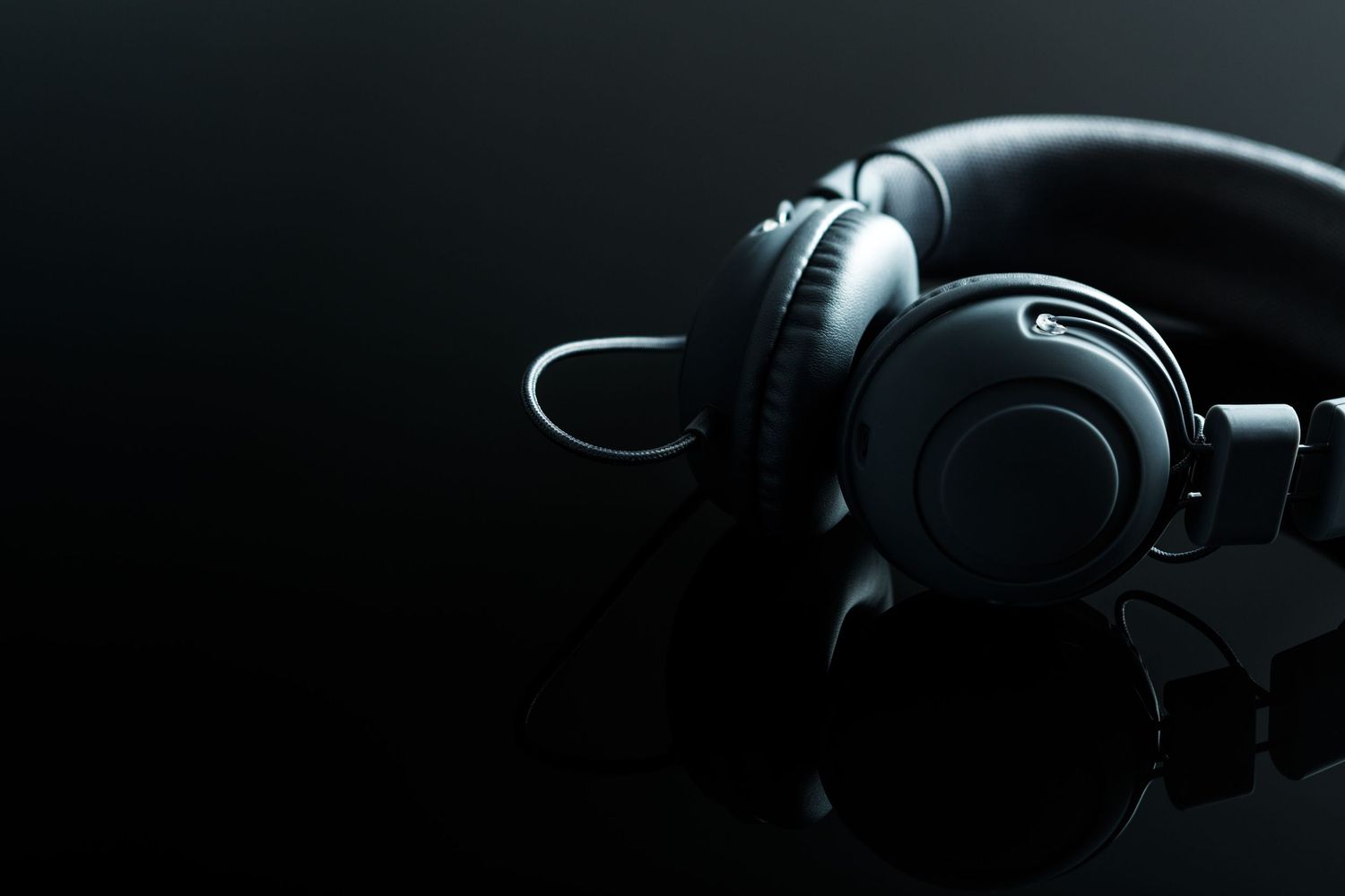 Headphones sitting on reflective surface