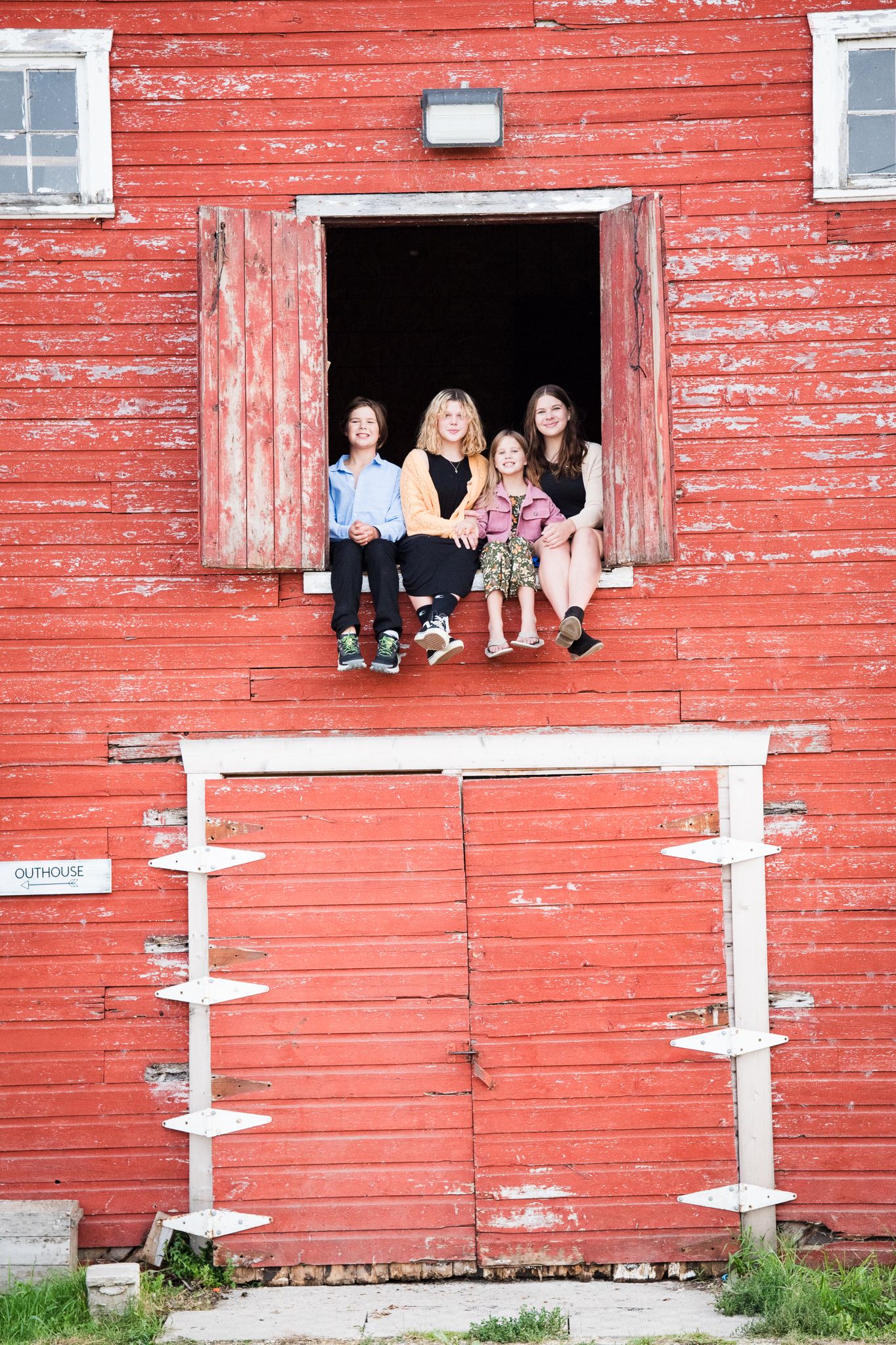 Siblings sitting in the loft
