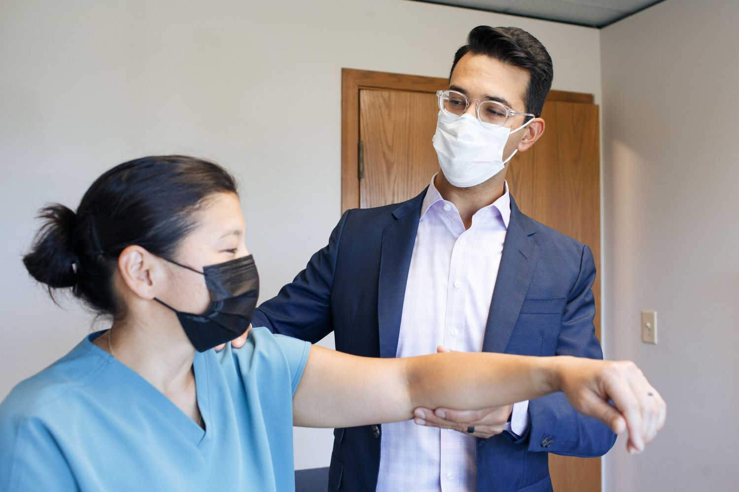 Everett marketing photographer: a doctor interacts with a patient at his clinic in downtown everett