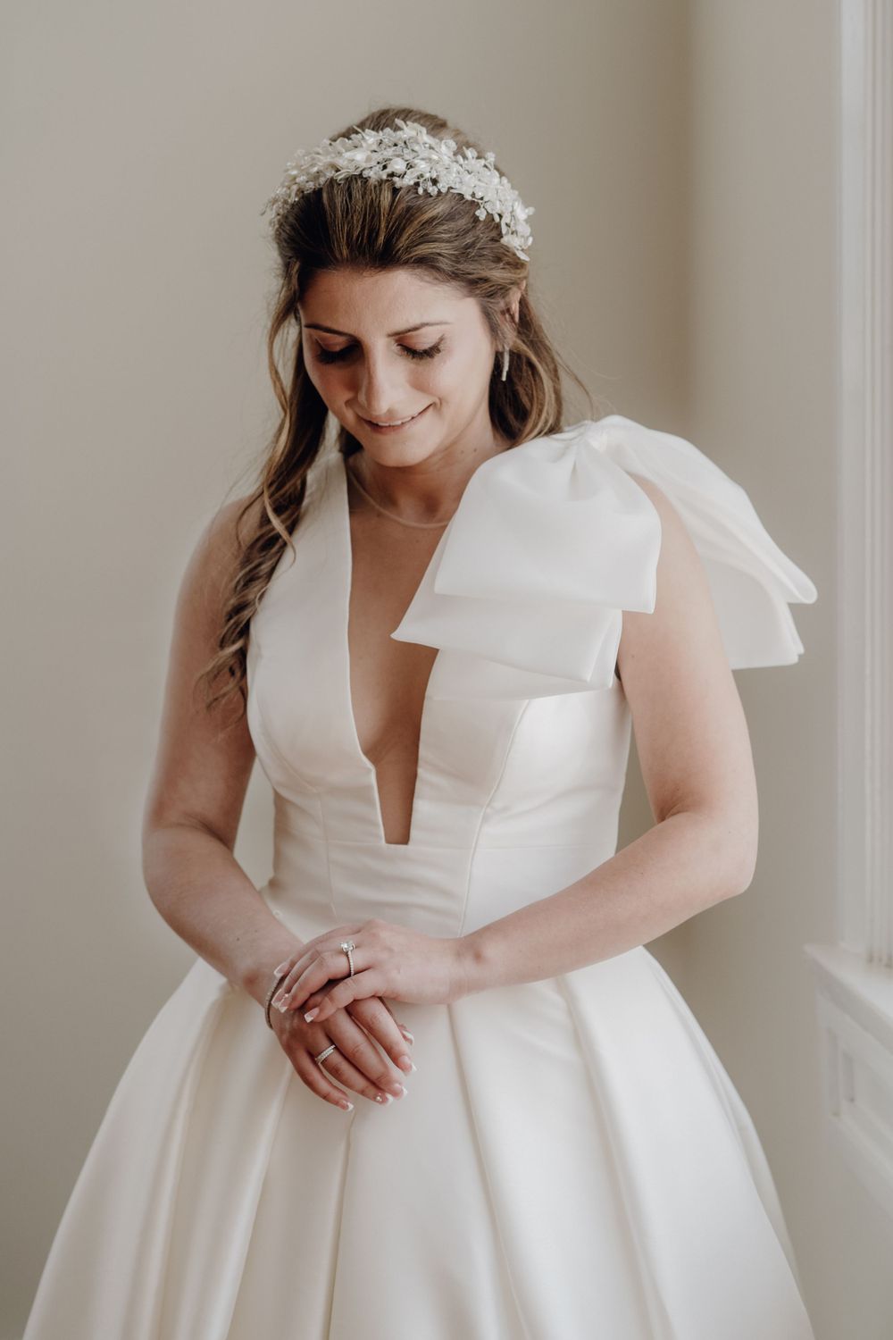 Bride's portrait looking down at her hands