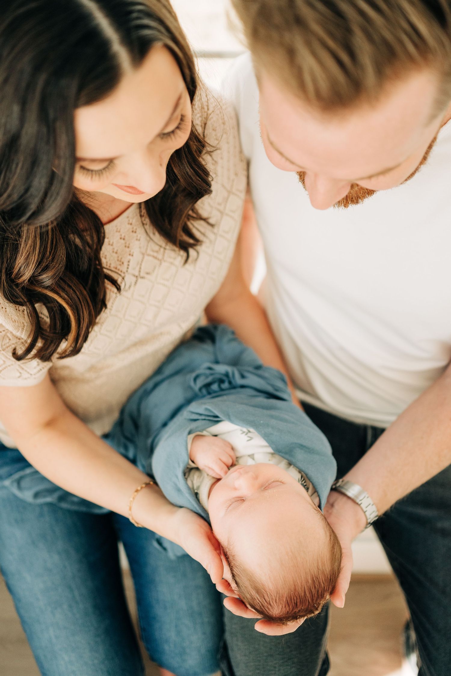simple pose for mom and dad during in home newborn session in Dallas, TX