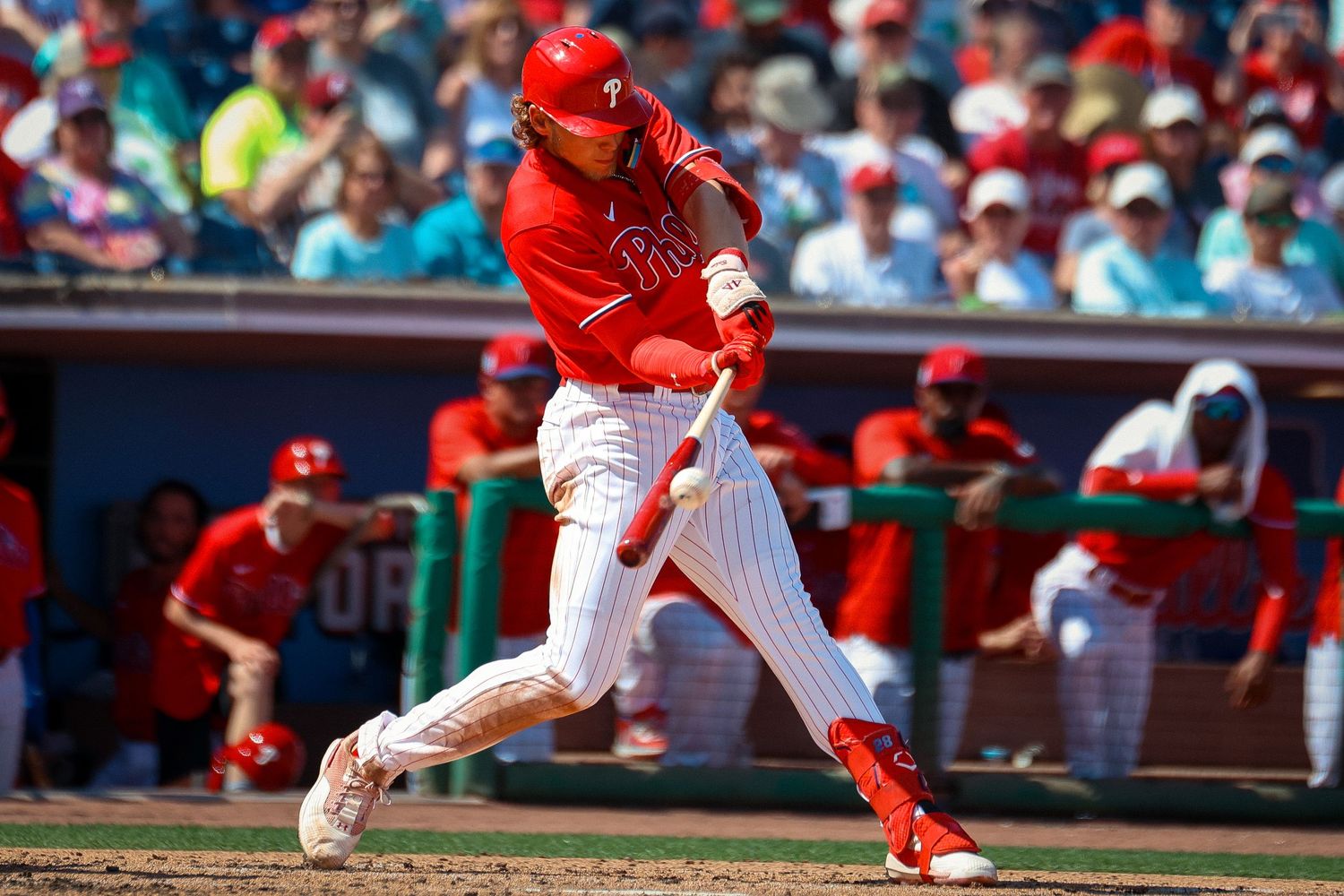 Alec Bohm, the third baseman for the Philadelphia Phillies, hits the ball with his bat.