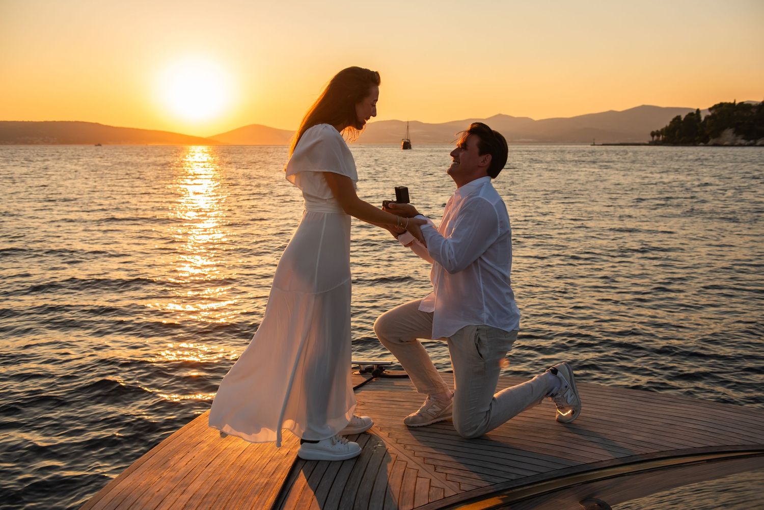 Sunset boat trip spontaneous proposal