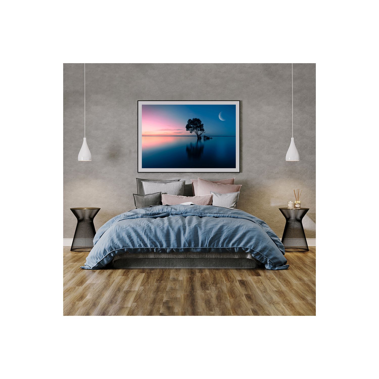 Modern bedroom interior with blue bedding and nature artwork featuring a tree silhouette against pink sunset sky.