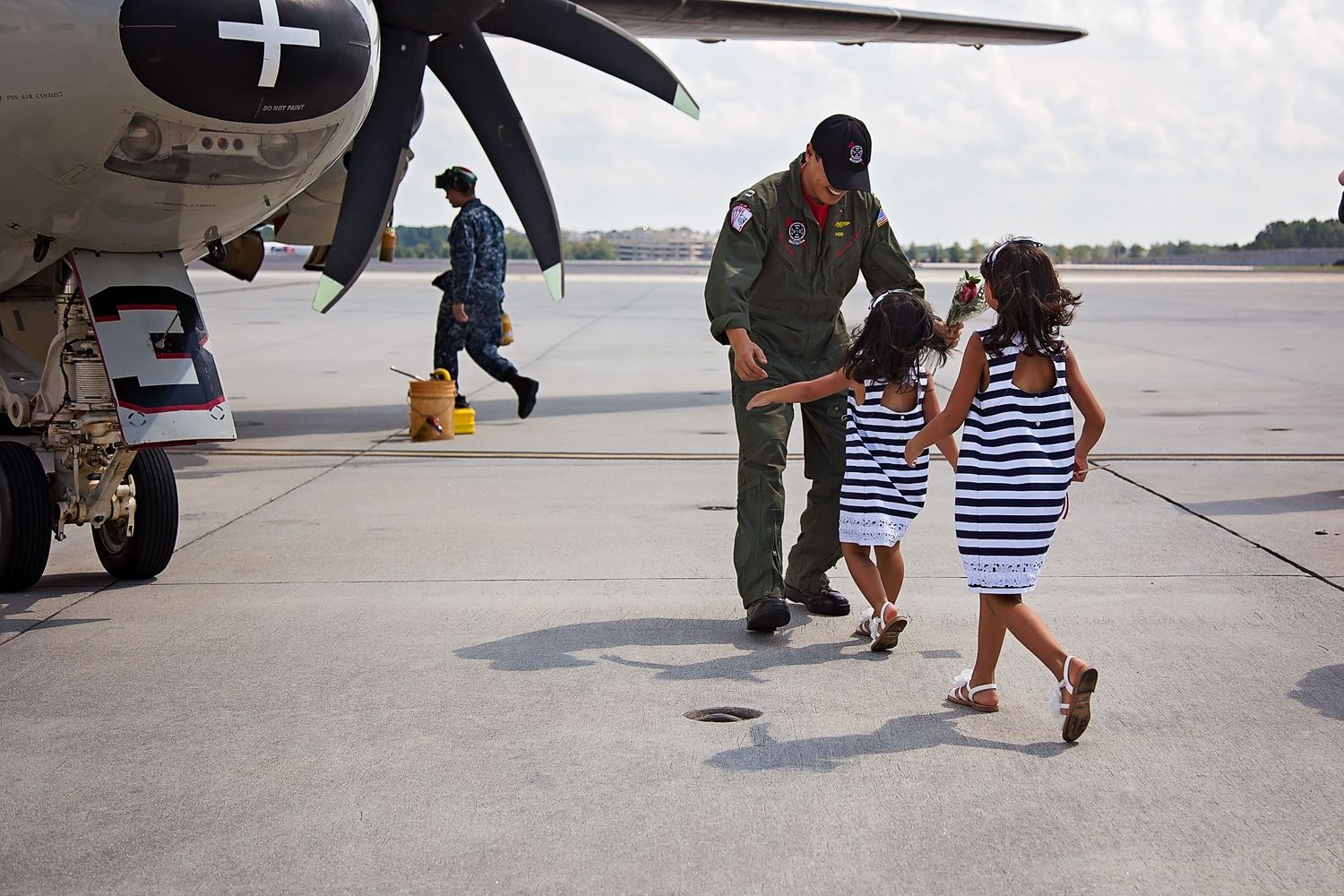 two girls running to dad at naval military homecoming in norfolk, virginia