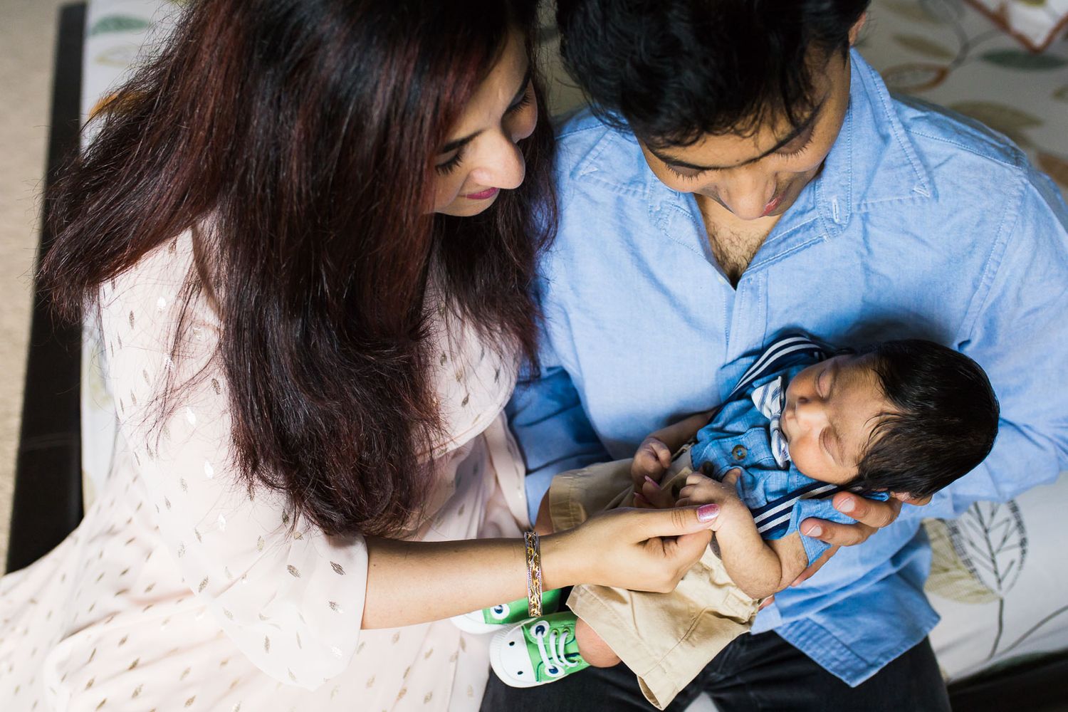 Family lovingly looking at newborn son