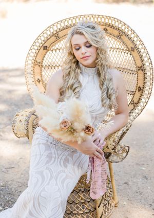 Bridal portrait sitting in wicker chair