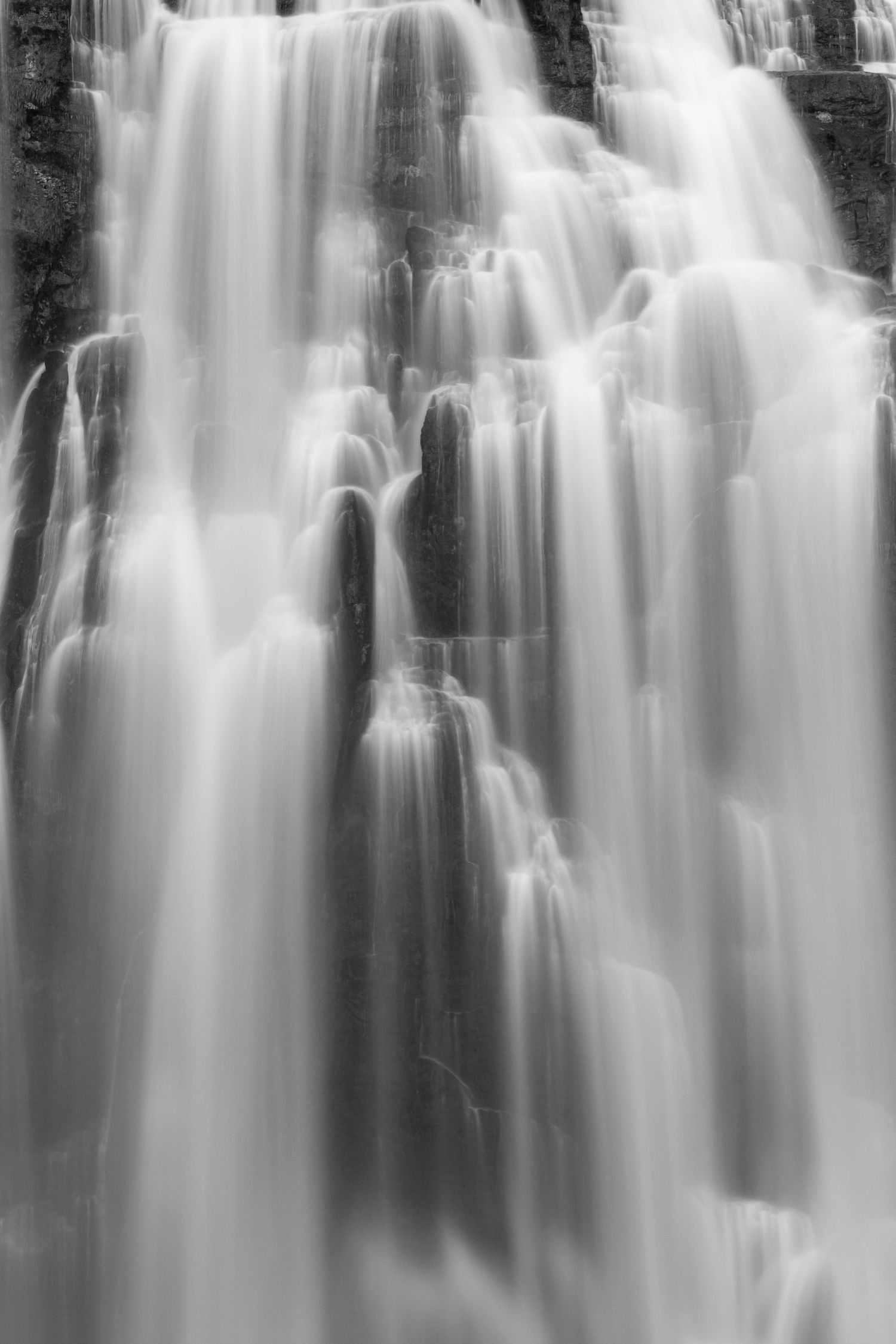 Silken cascades flow in monochrome, a timeless capture of motion and tranquility.