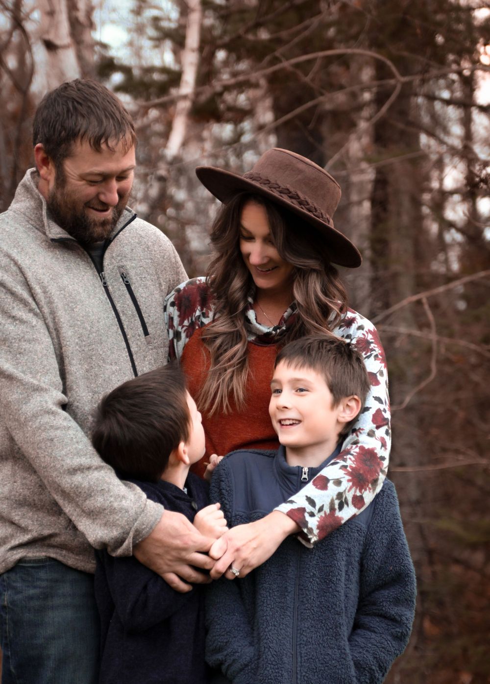Cute family posing for fall family couples portraits in Wisconsin