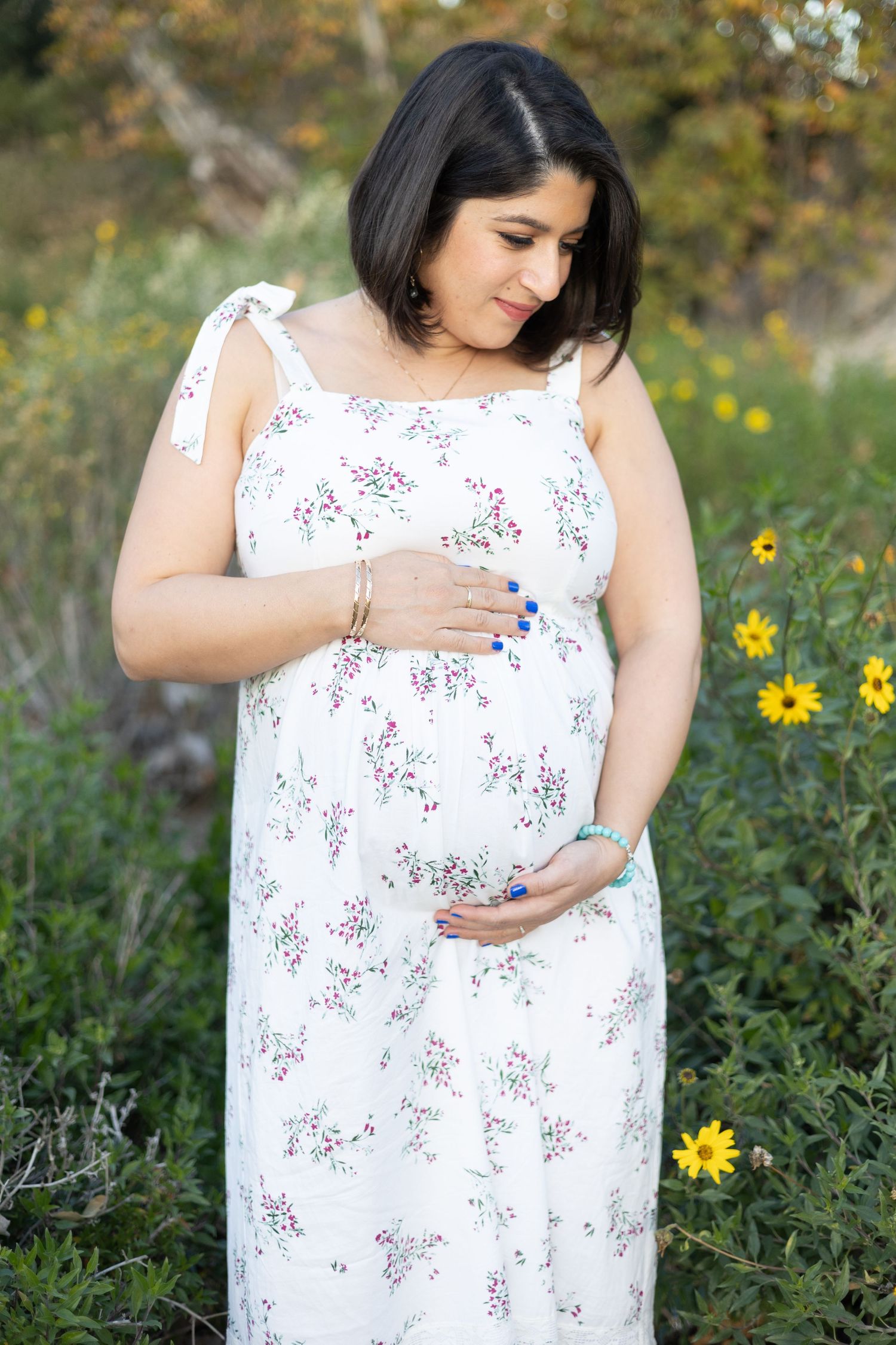 Maternity session with mom's hands on her belly