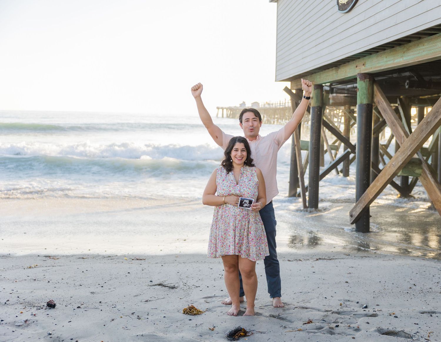 Pregnancy announcement session at the pier in San Clemente