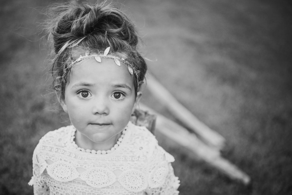 Artistic black and white close-up portrait with delicate lace details.