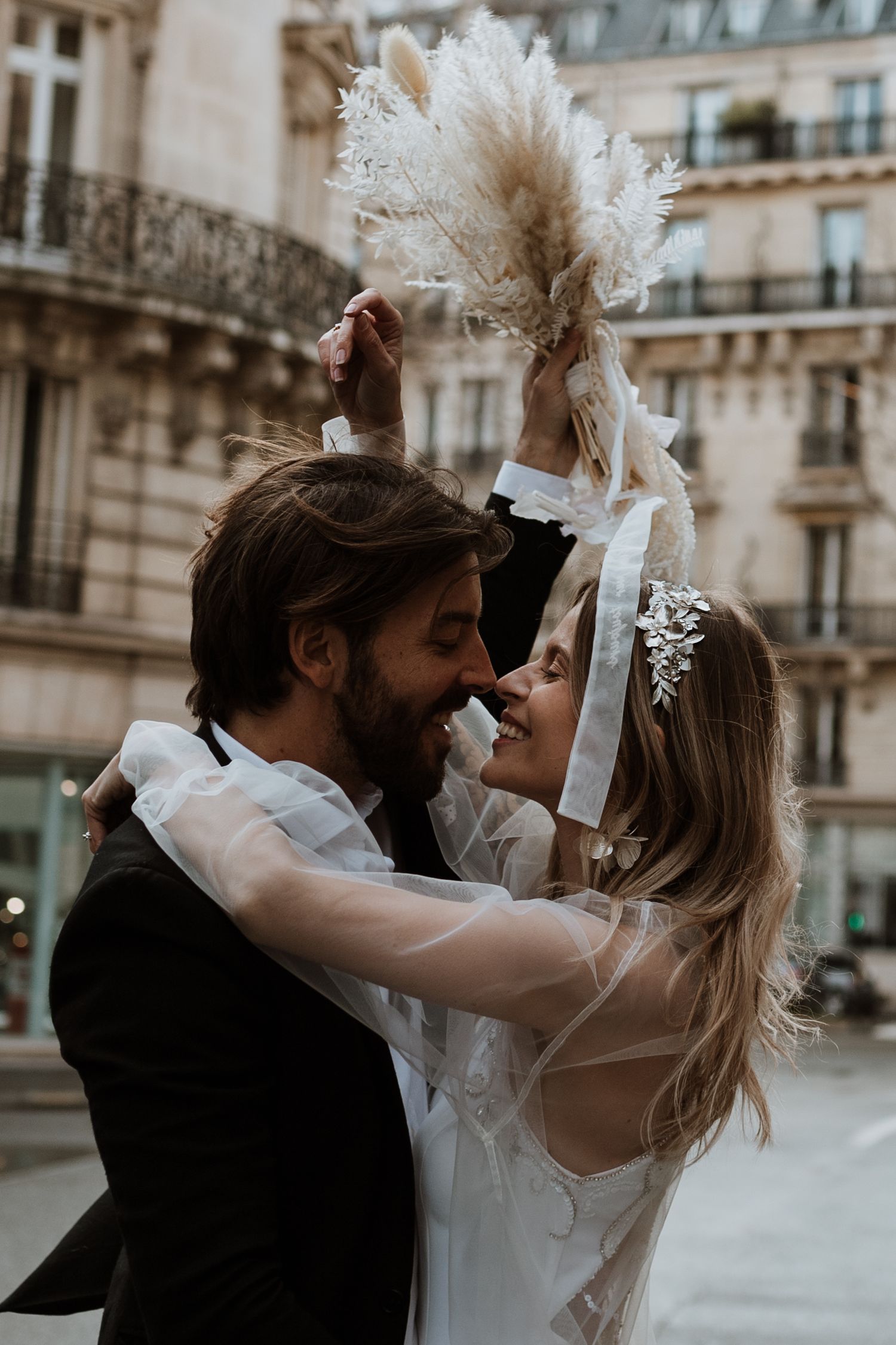 Couple having fun on their wedding day in Paris