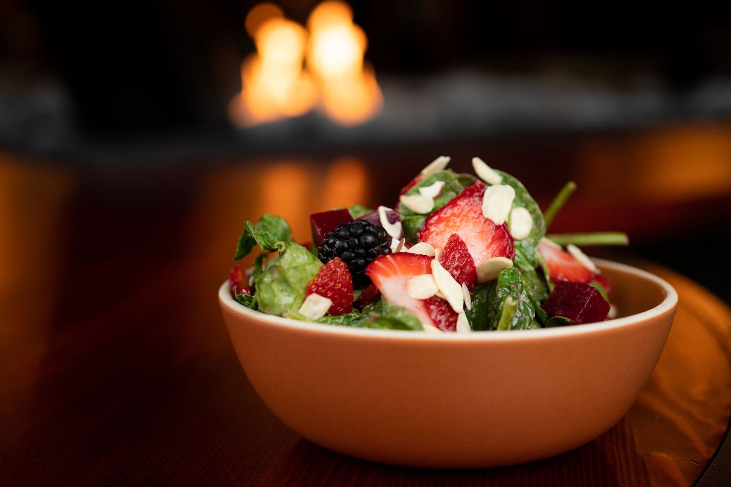 Atmospheric restaurant lighting with elegant plated dishes in warm ambiance.