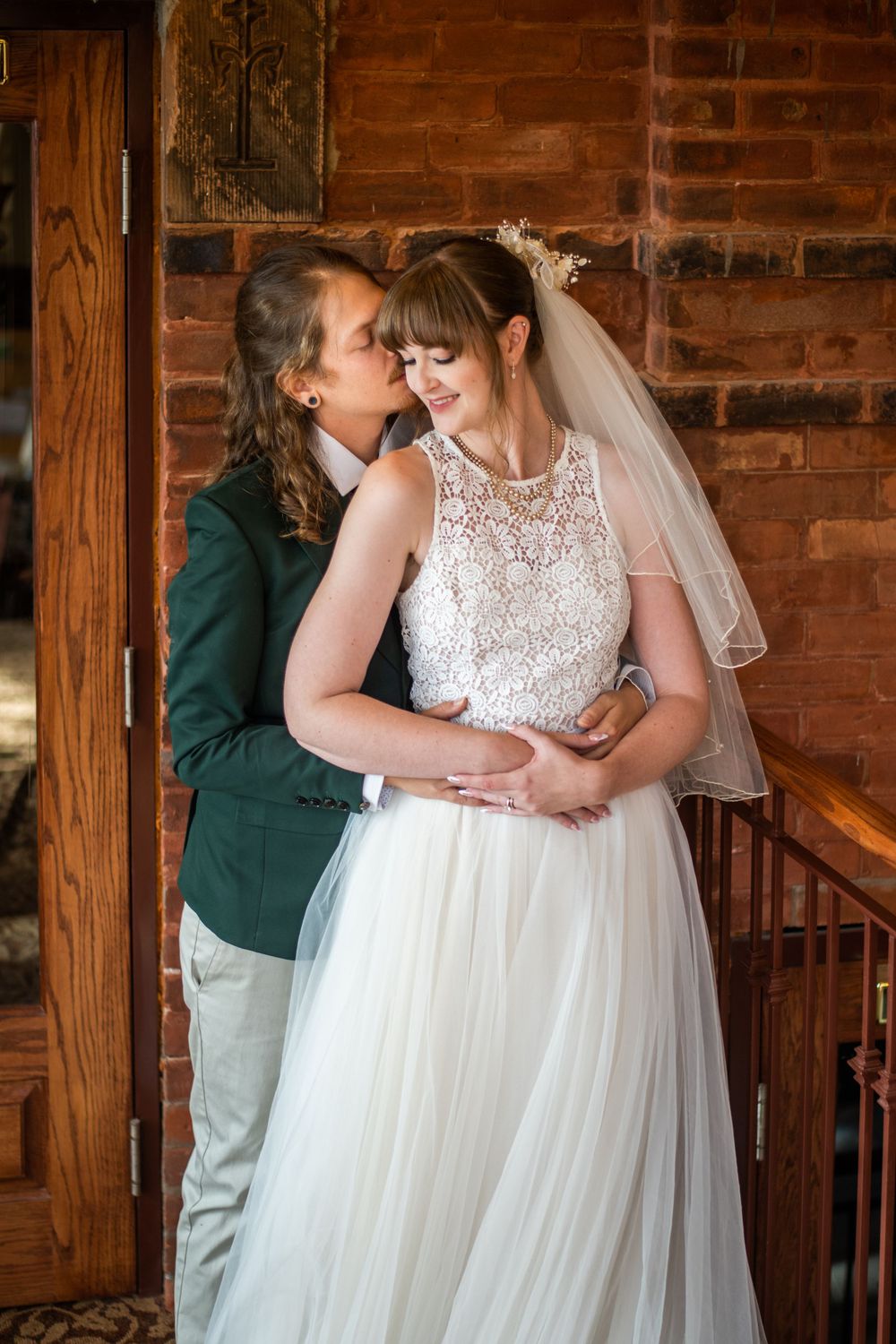 bride and groom hugging embracing acton town hall wedding