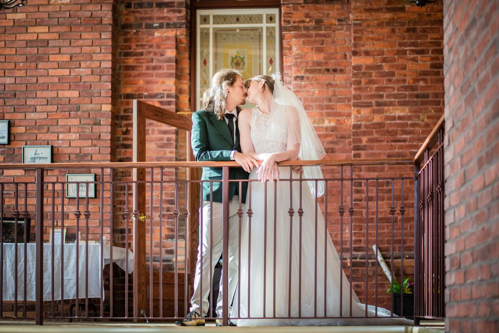bride and groom kissing acton town hall wedding