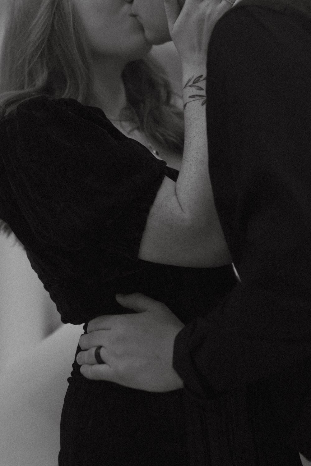 Intimate black and white portrait of a romantic embrace.