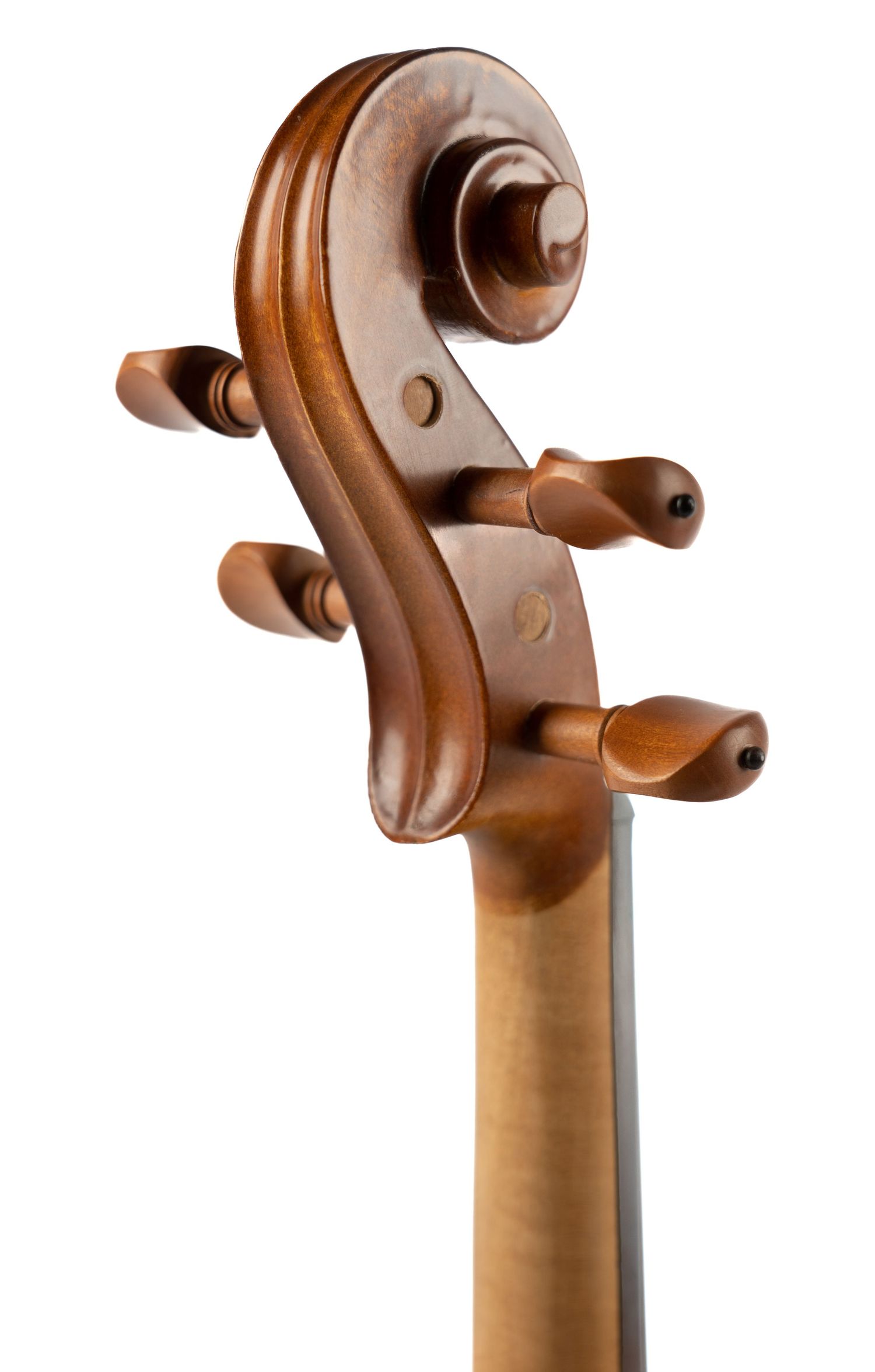 Detailed view of violin scroll and pegbox showing traditional carved design.