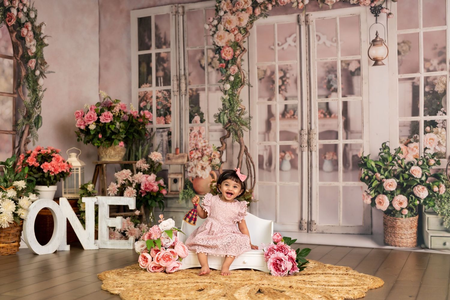 Toddler enjoying a 1st birthday cake smash session in a Bothell studio. Fun, authentic birthday photography by Filling the Frame Photography