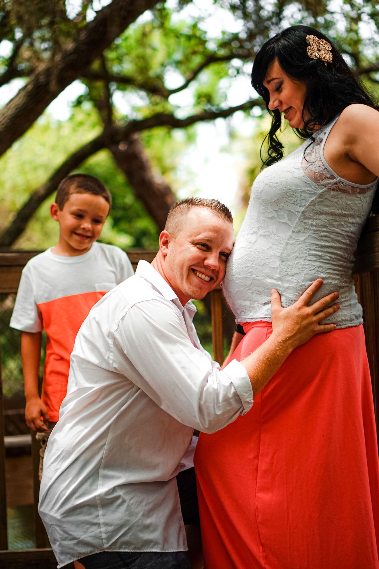 Dad with his head to moms belly shot by autumn hutton motherhood maternity photographer