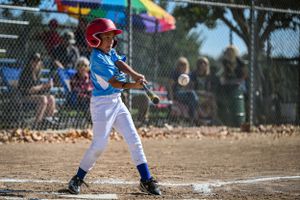 baseball player hitting the ball