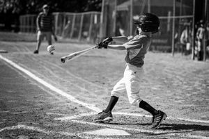 baseball player hitting the ball