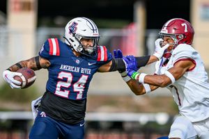 football player stiff arm