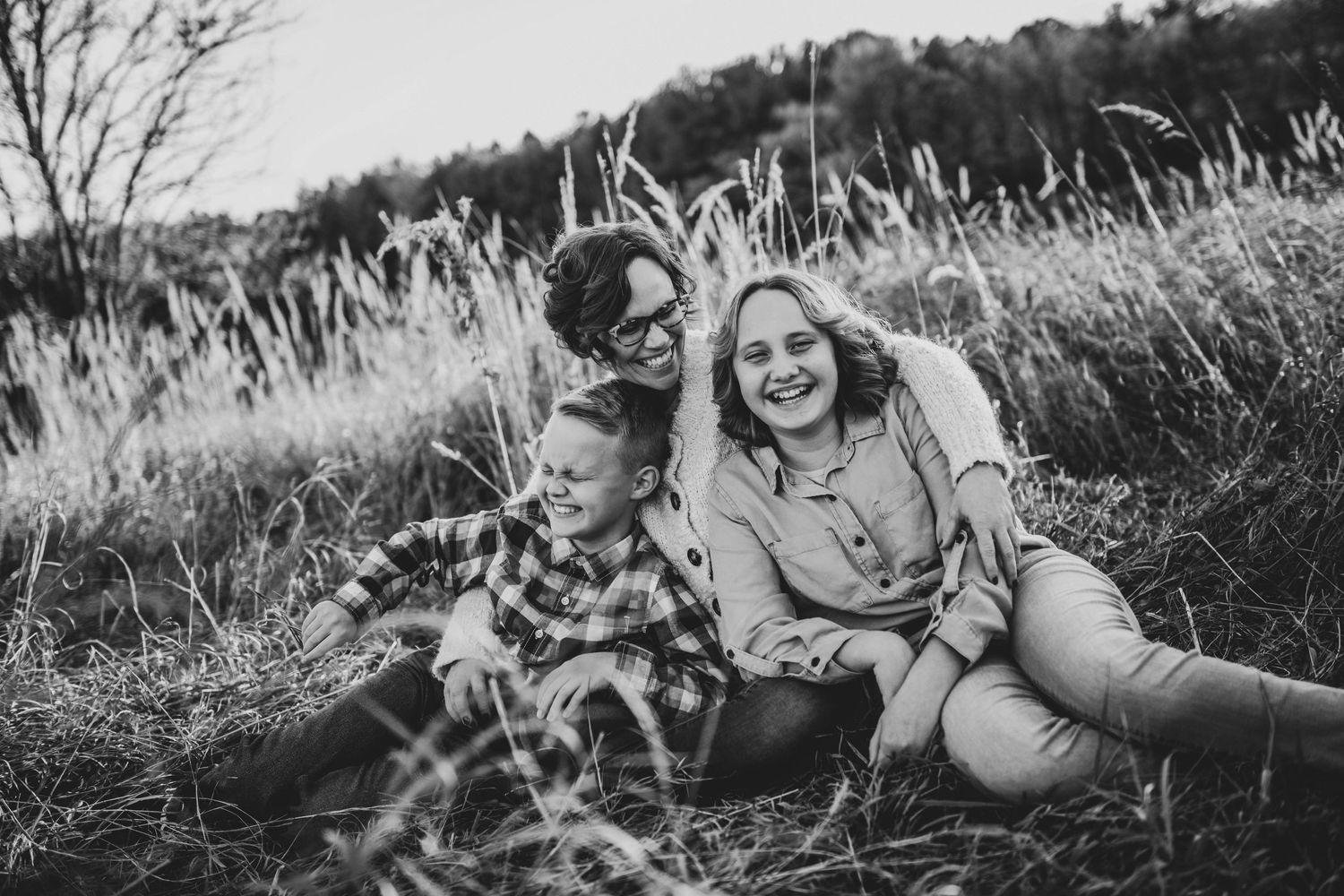 laughing family hugging together