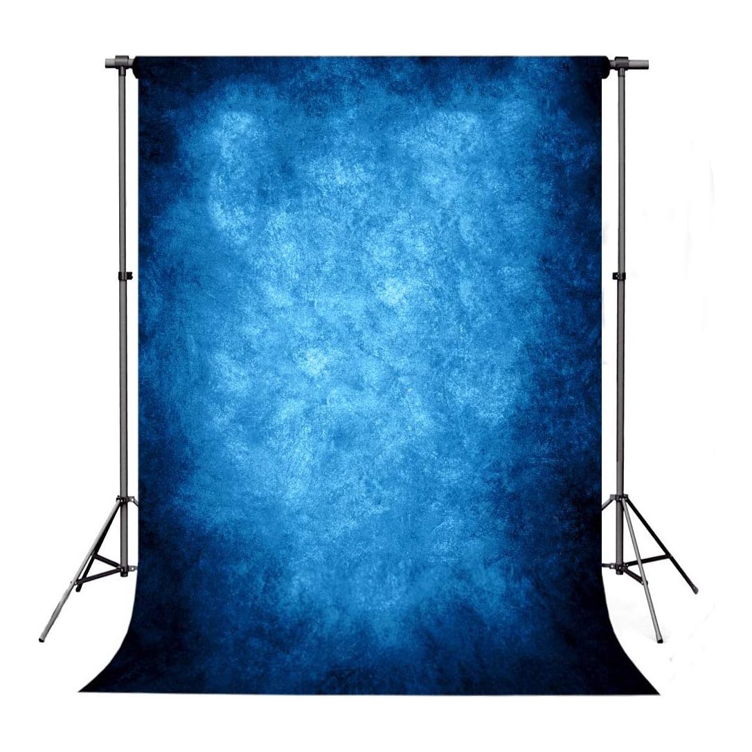Deep blue textured photography backdrop with vignette effect.