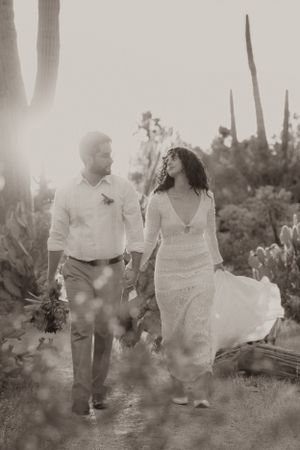 A dreamy black and white photo sequence of a couple dancing in a natural outdoor setting.
