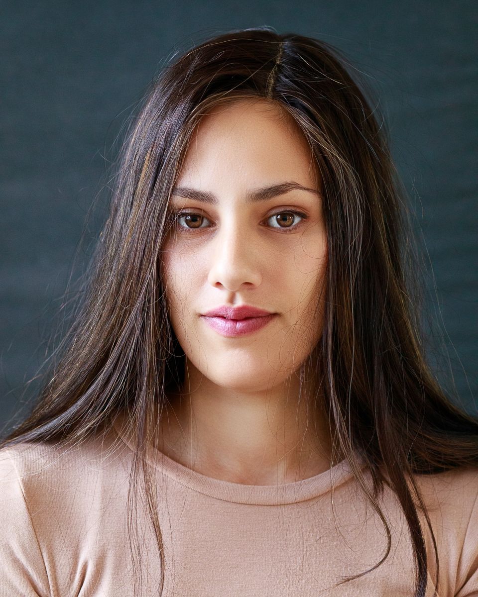 A portrait photo of a beautiful young woman photographer, the owner of this site