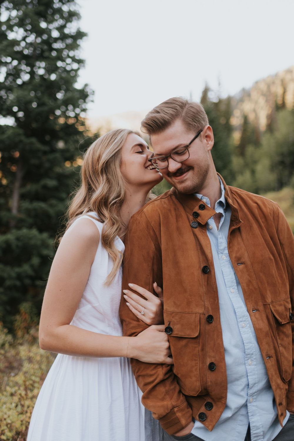 An engaged couple beautifully photographed during their summer engagement session in Big Cottonwood Canyon.